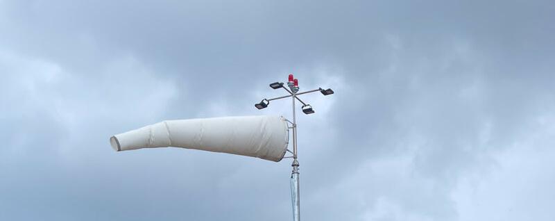 CASA aviation white Windsock in operation at an airstrip