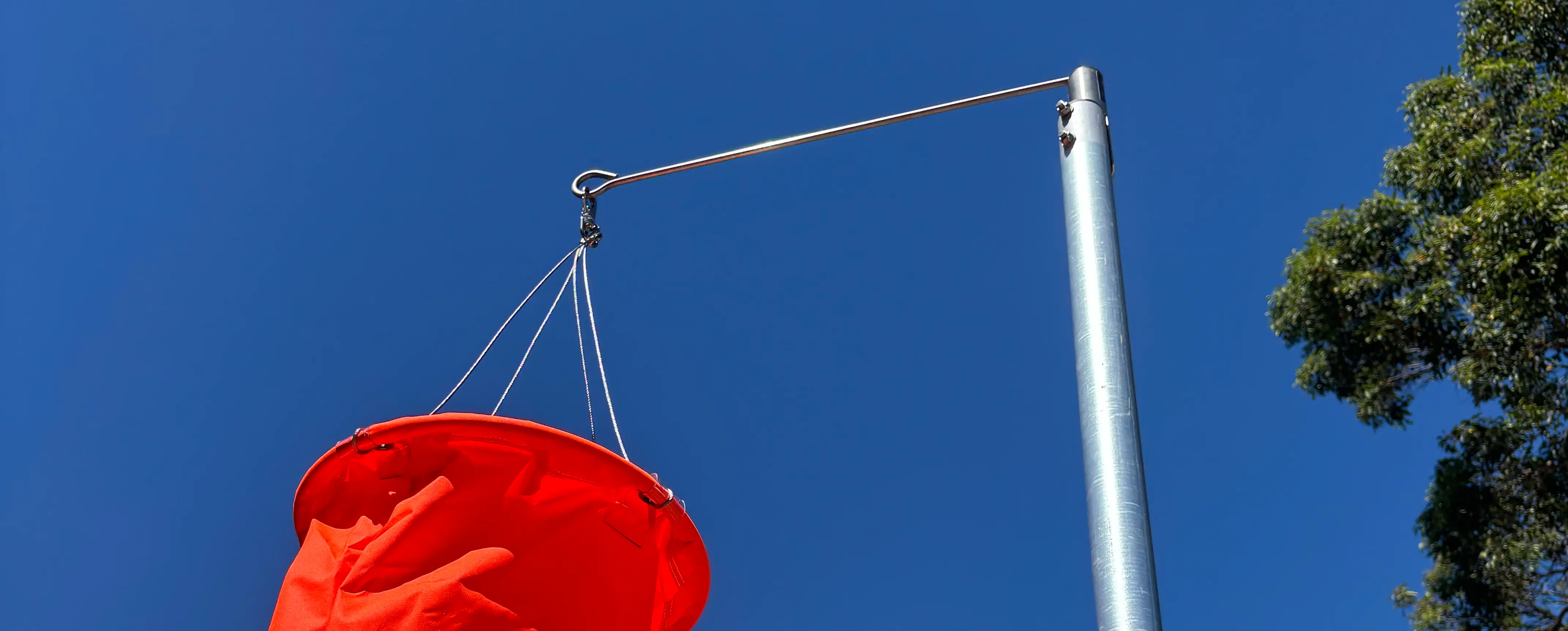 Rotor arm pivot with Windsock and bridle harness