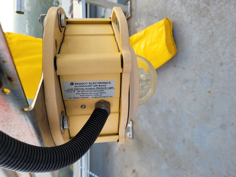 Windsock with obstruction light showing wind speed indication