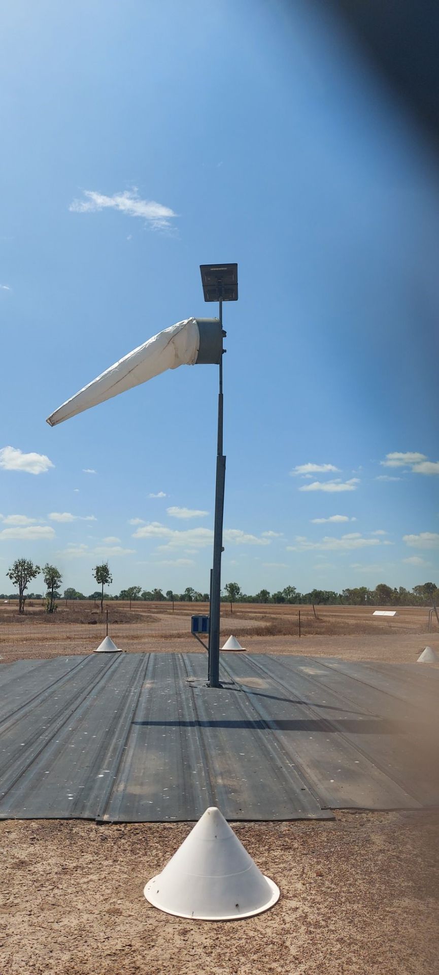 Remote Australian airstrip showing ideal open Windsock location